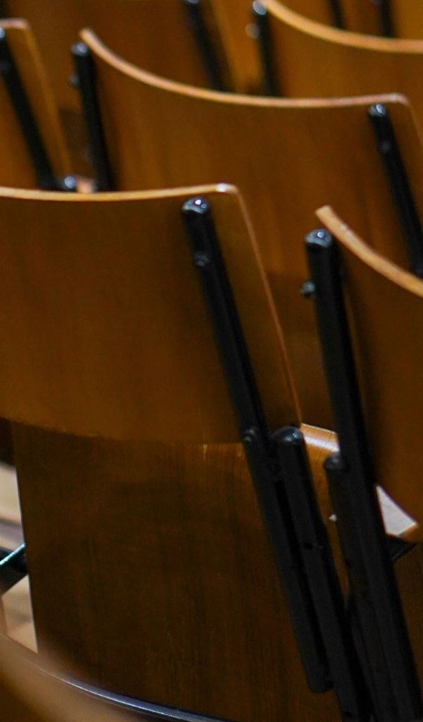 Rows of wooden lecture hall seats